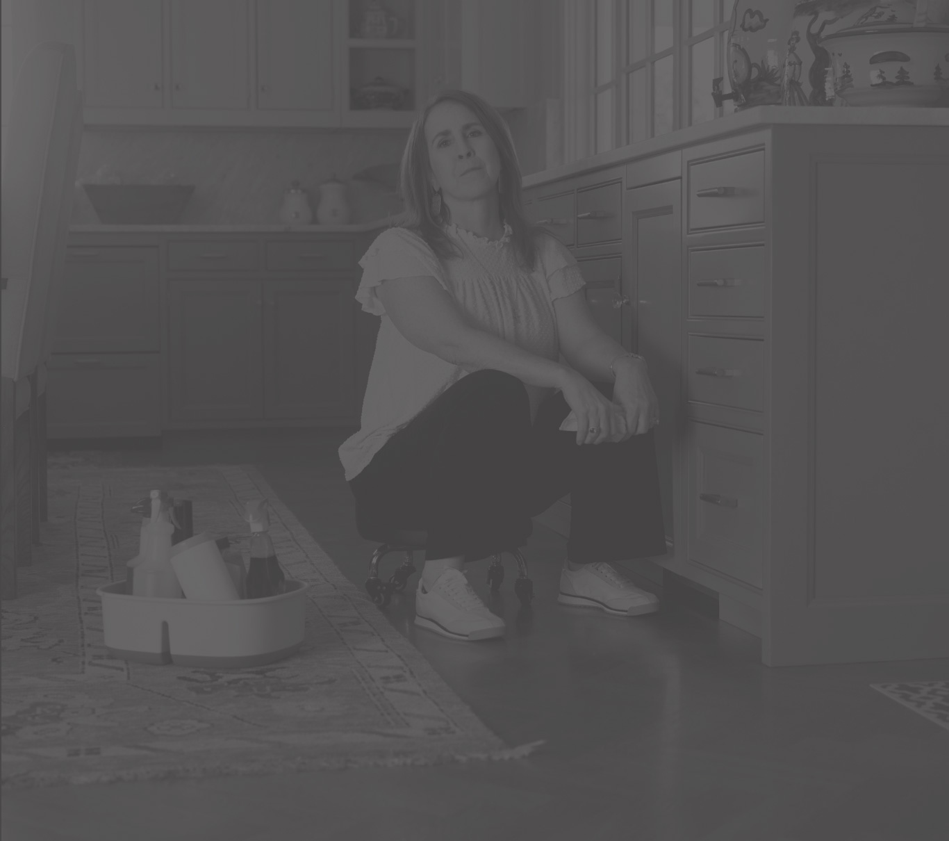 Ambassador Kerri, who has LOPD, sitting on a rolling stool