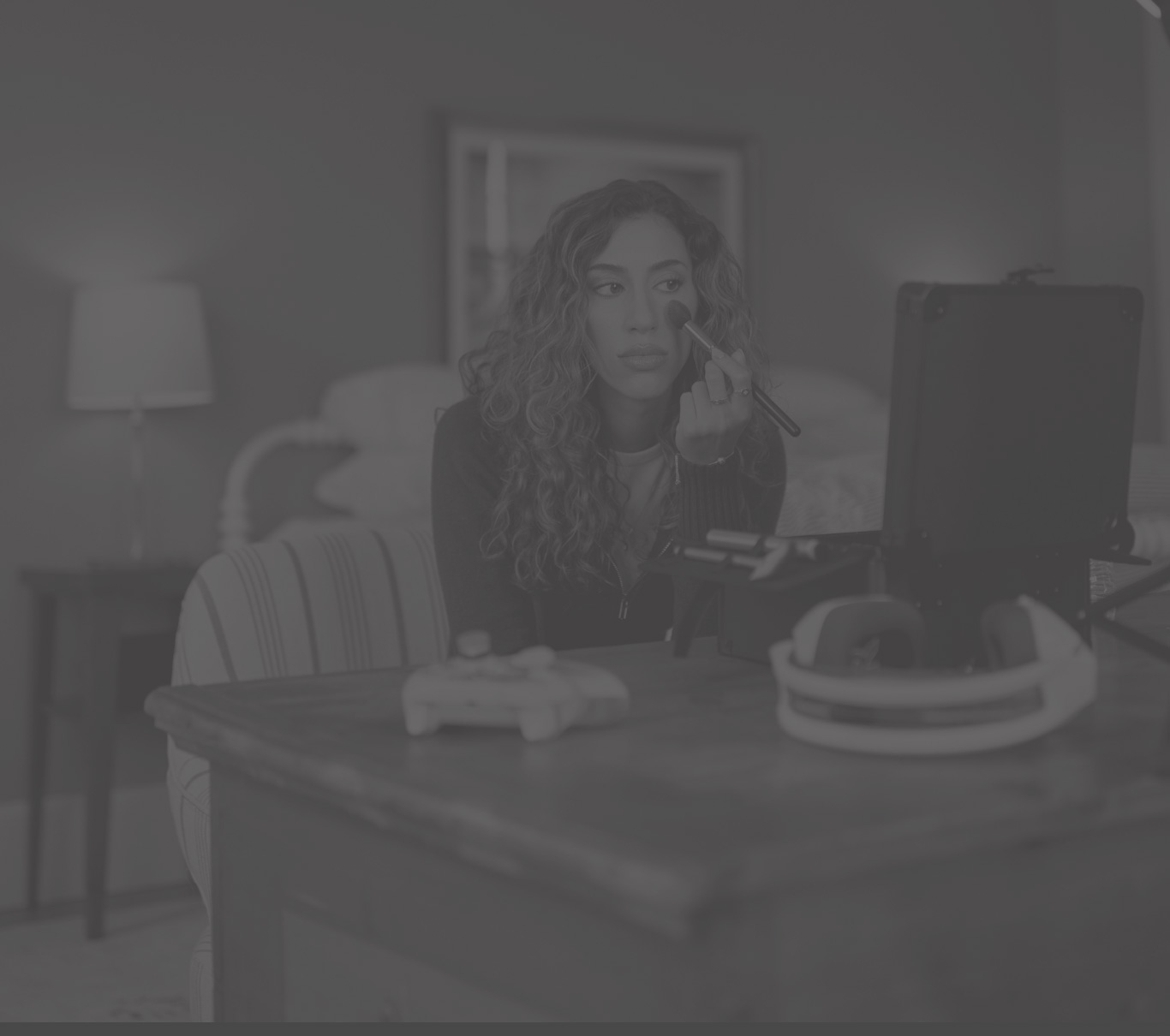 Ambassador Veronica, who has LOPD, looking in a mirror and putting on makeup